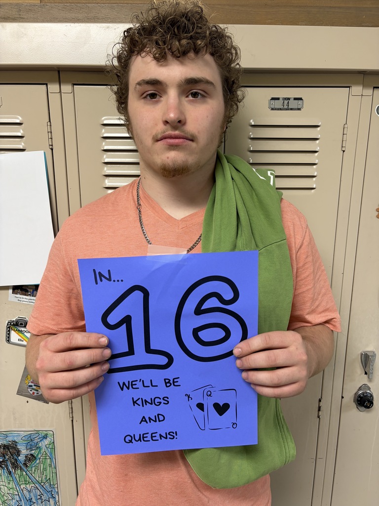 Student holding sign