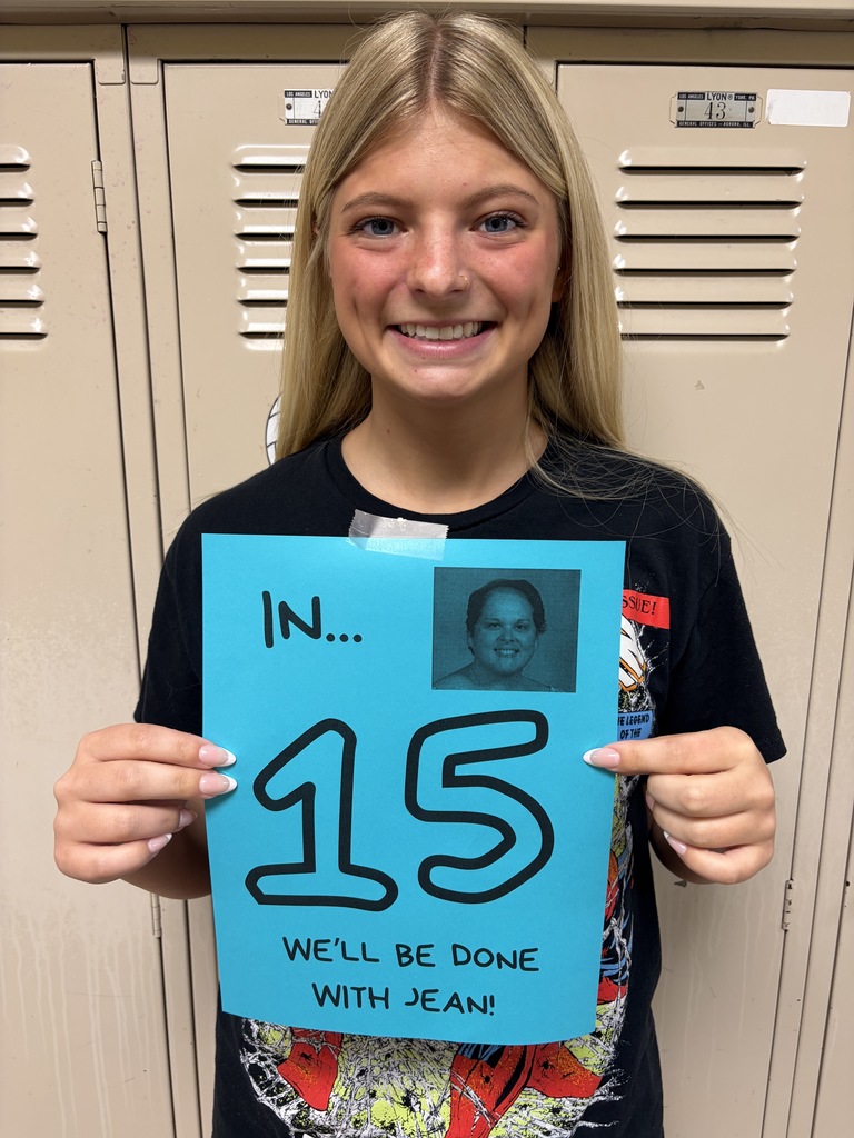 Student holding sign
