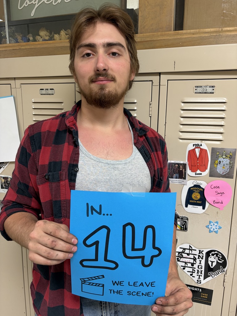 Student holding sign