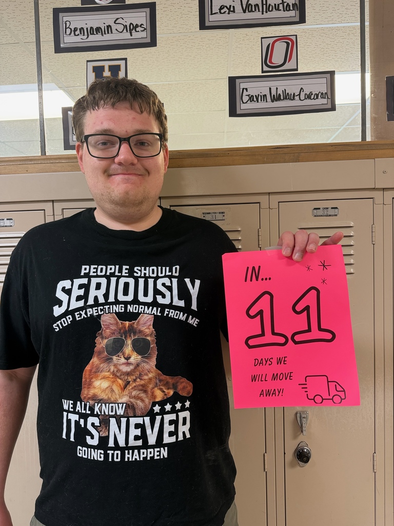 Student holding sign