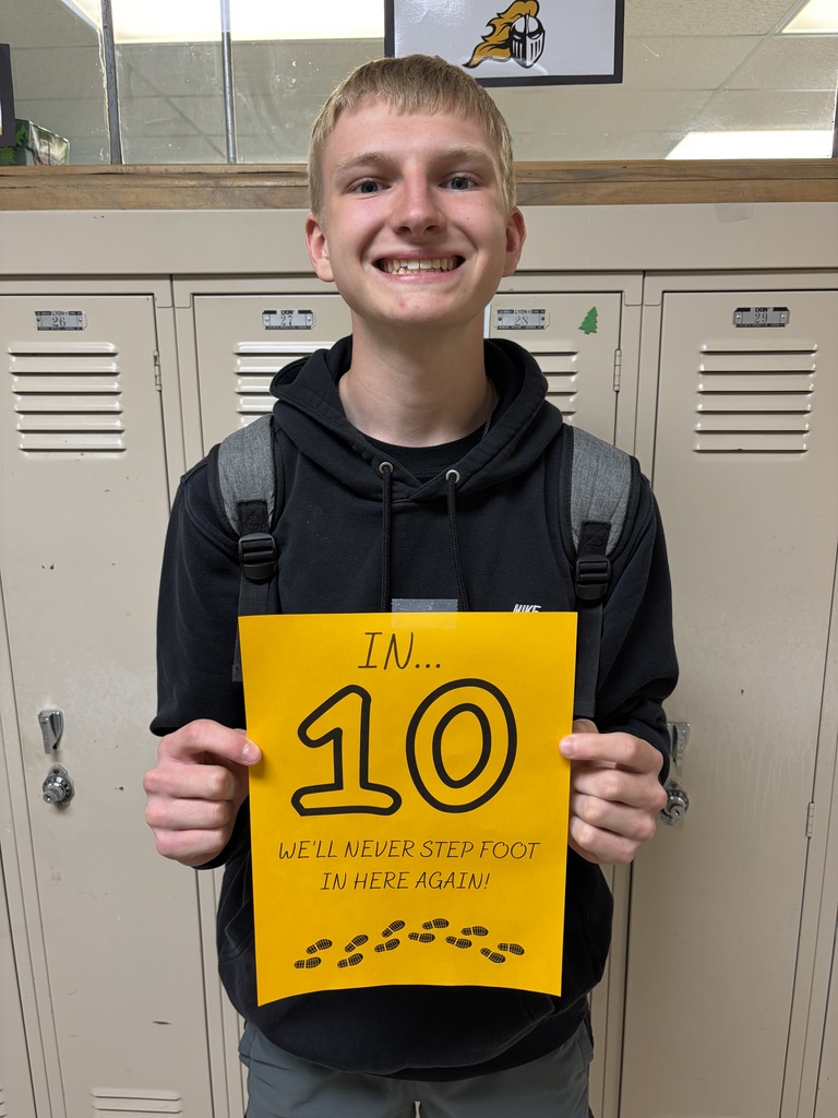 Student holding sign