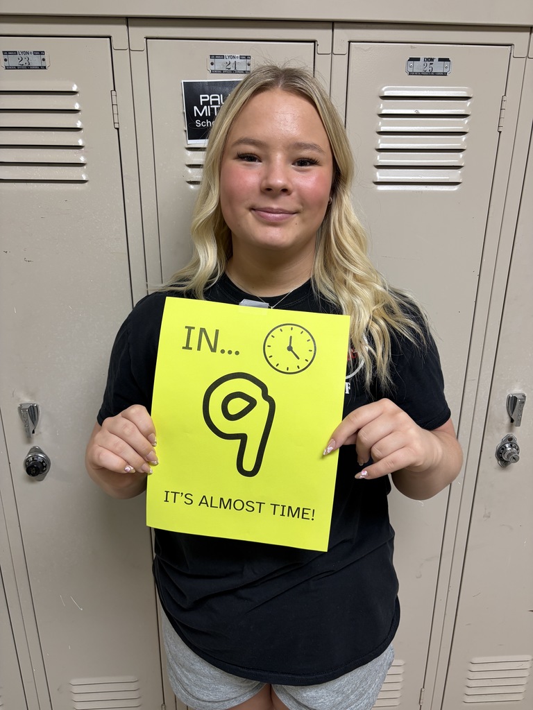 Student holding sign