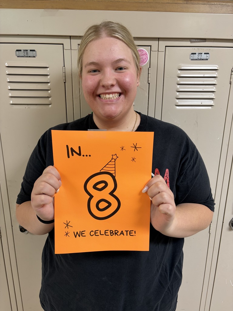 Student holding sign