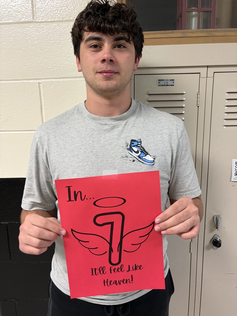 Student holding sign