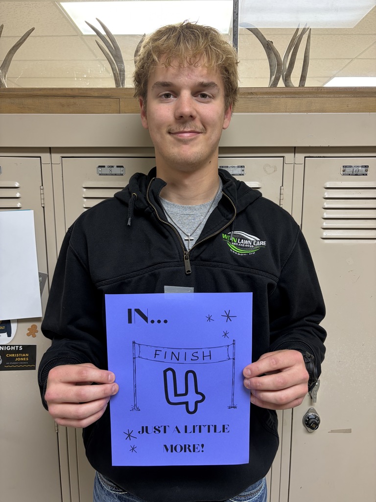 Student holding sign