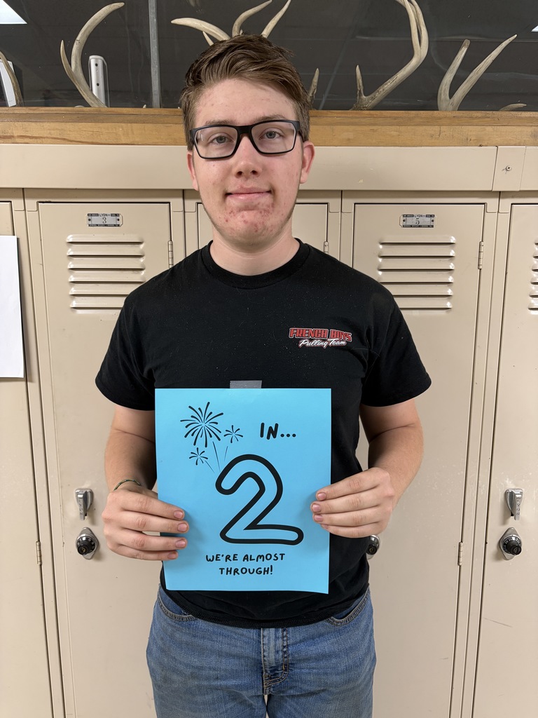 Student holding sign