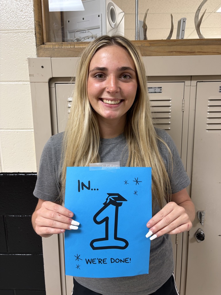 Student holding sign
