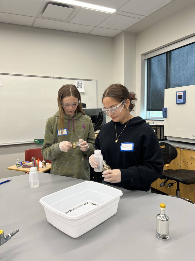 two girls at a lab table