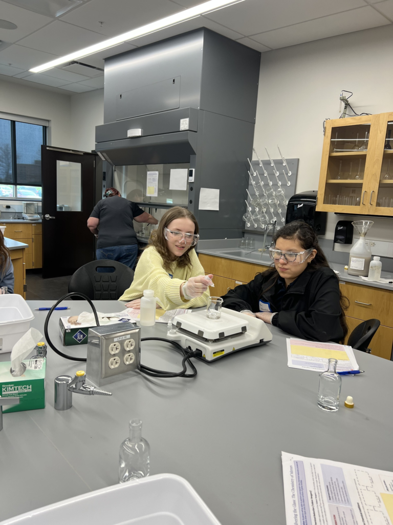 two girls performing an experiment