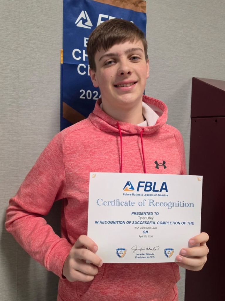 Tyler Drey holding FBLA Certificate