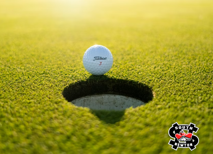 golf ball on green with south newton logo