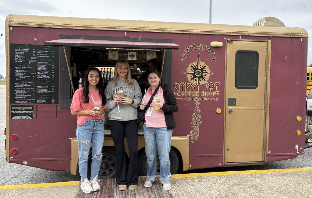 gypsy joe coffee truck with students holding drinks