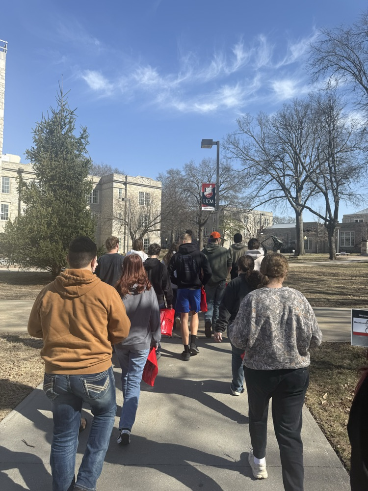 students walking on sidewalk