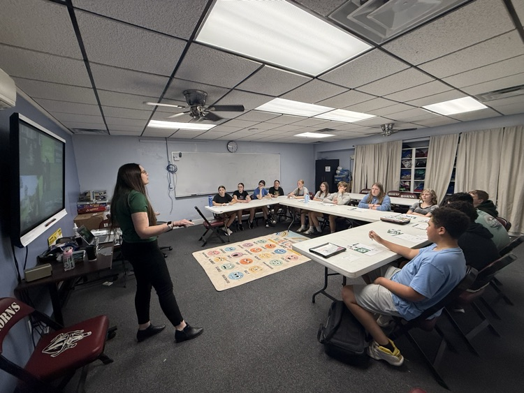 presenter talking to students 