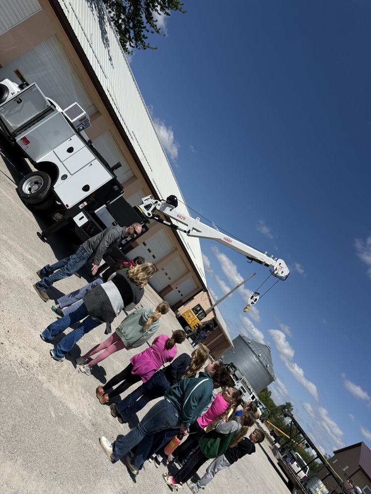 students looking at summit truck 