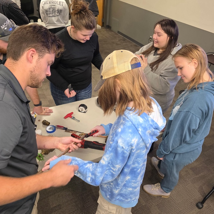 students practicing hands on skills