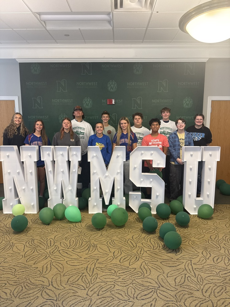 students behind sign