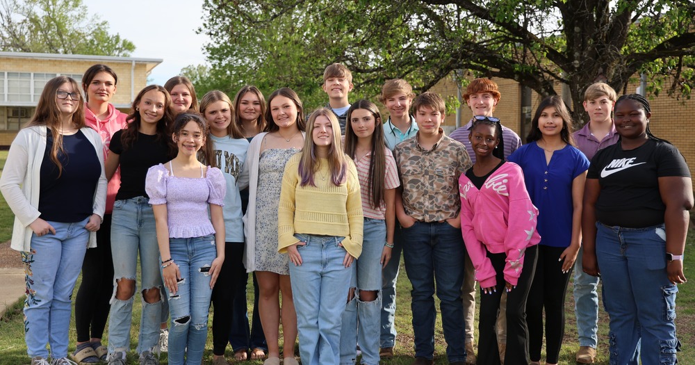 group of junior high students standing outside