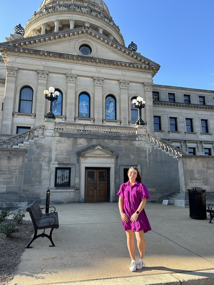 Meredith Cossey in front of the capital building