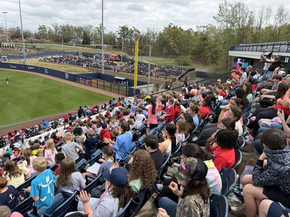 crowd of elementary and middle school students in stadium seats