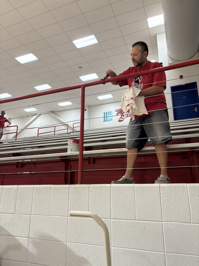 coaches painting SPHS gym