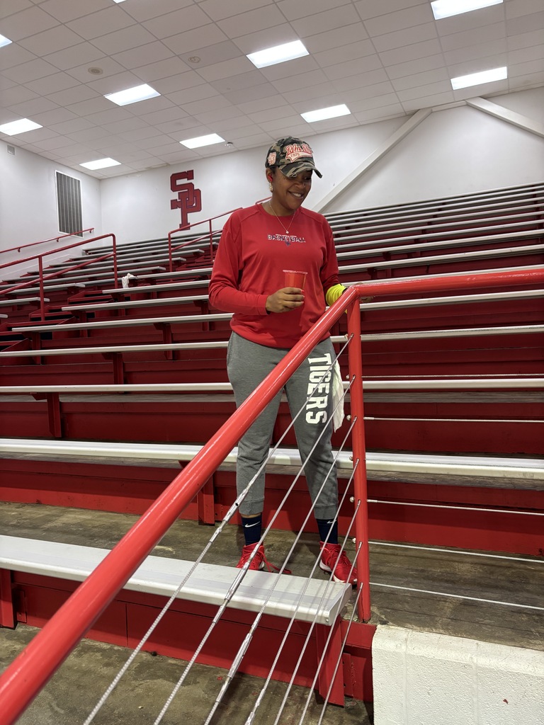 coaches painting SPHS gym