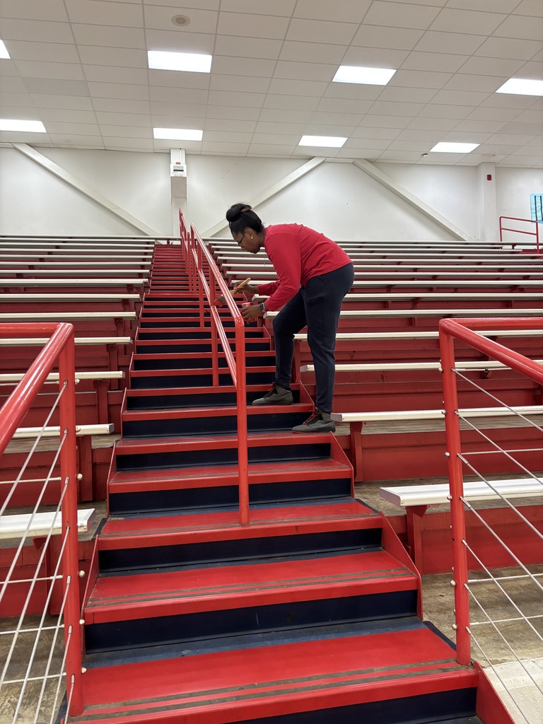 coaches painting SPHS gym