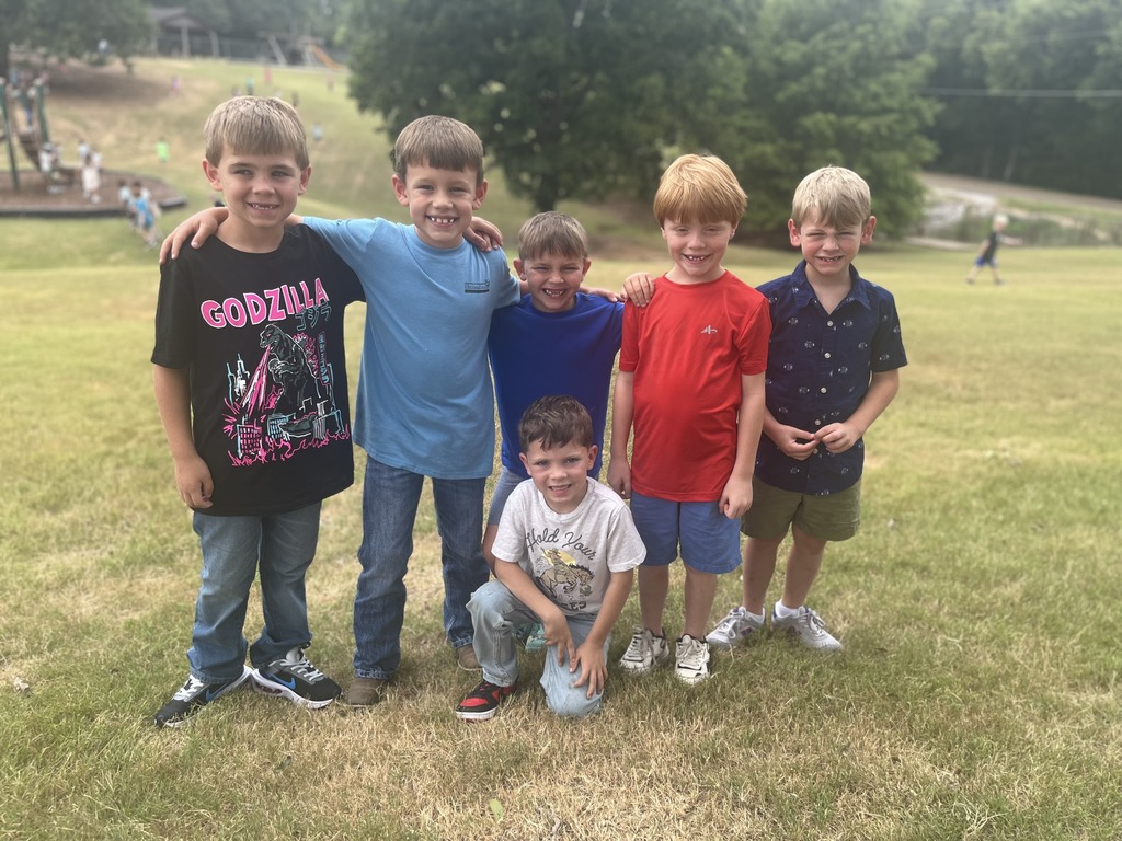 elementary students posing on a playground