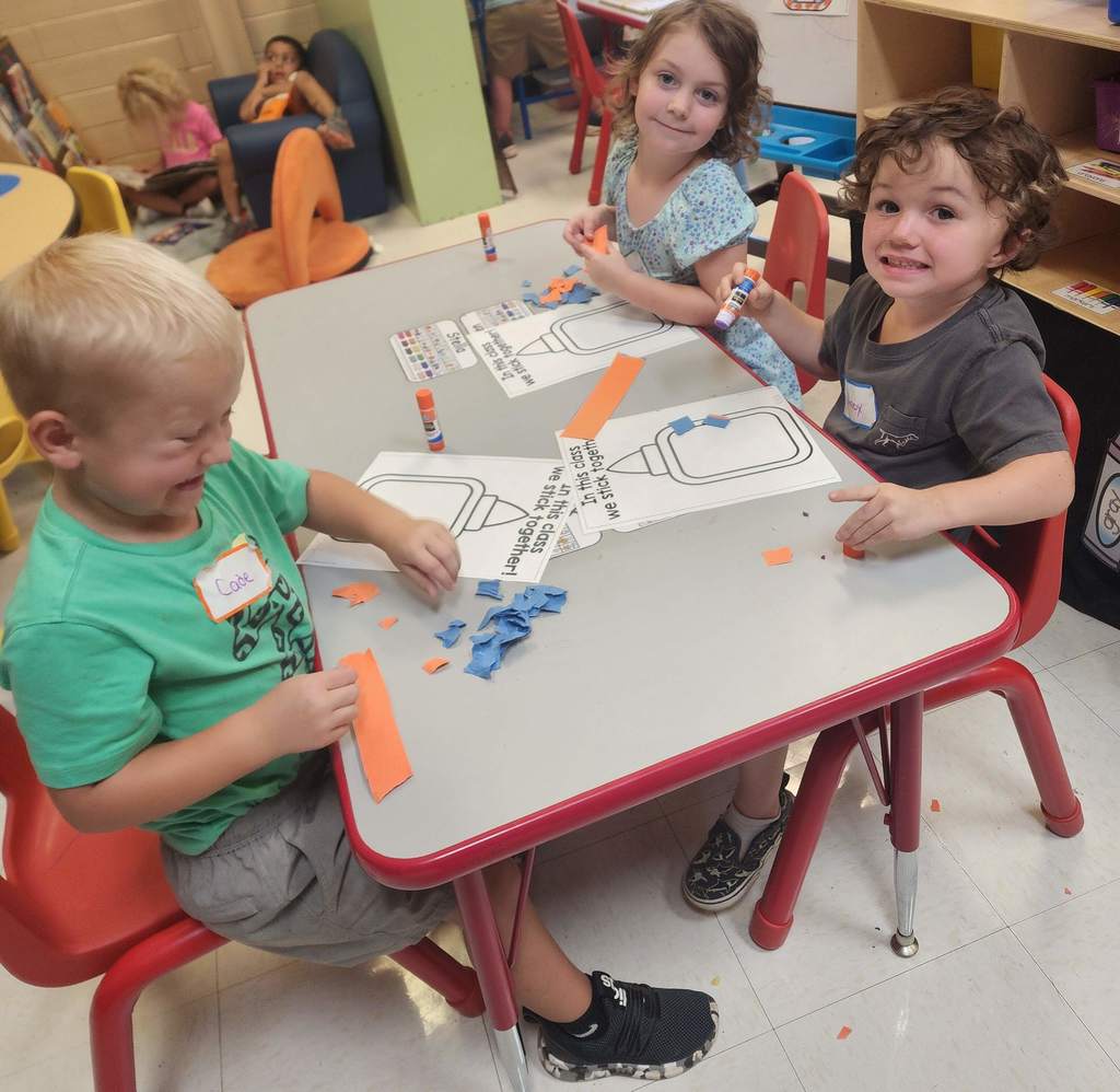 PreK students working at tables