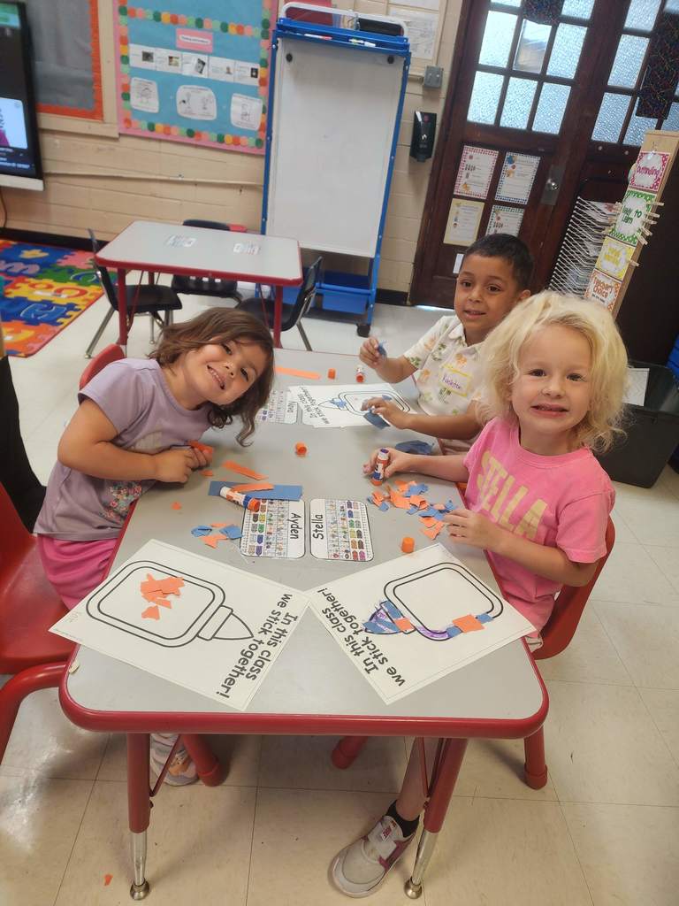 PreK students working at tables