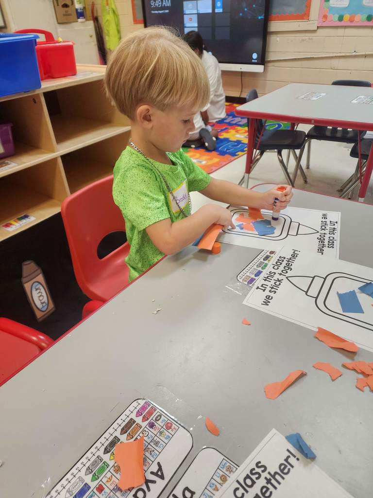 PreK students working at tables