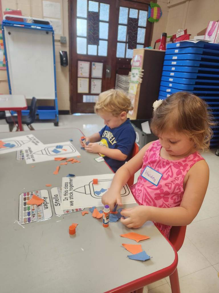 PreK students working at tables
