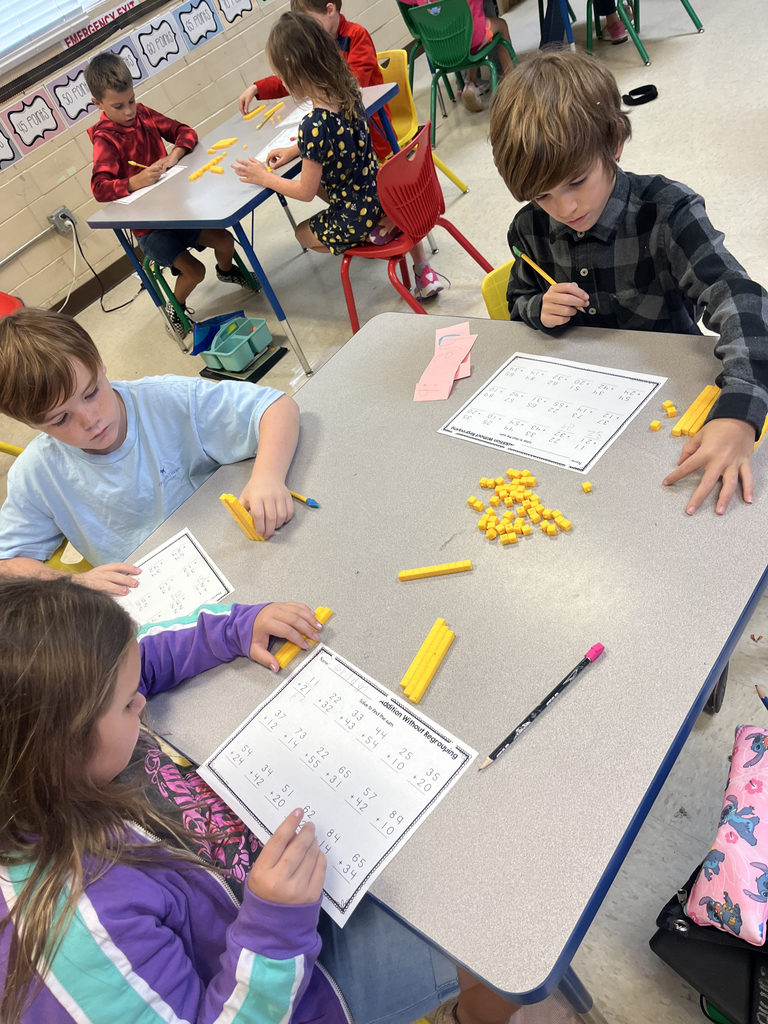2nd grade students using manipulatives