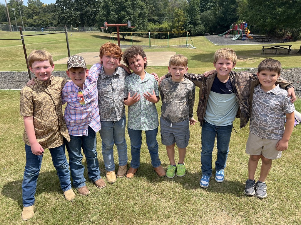 Elementary students dressed in camo