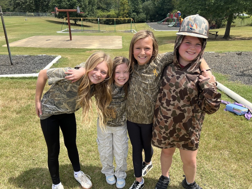 Elementary students dressed in camo