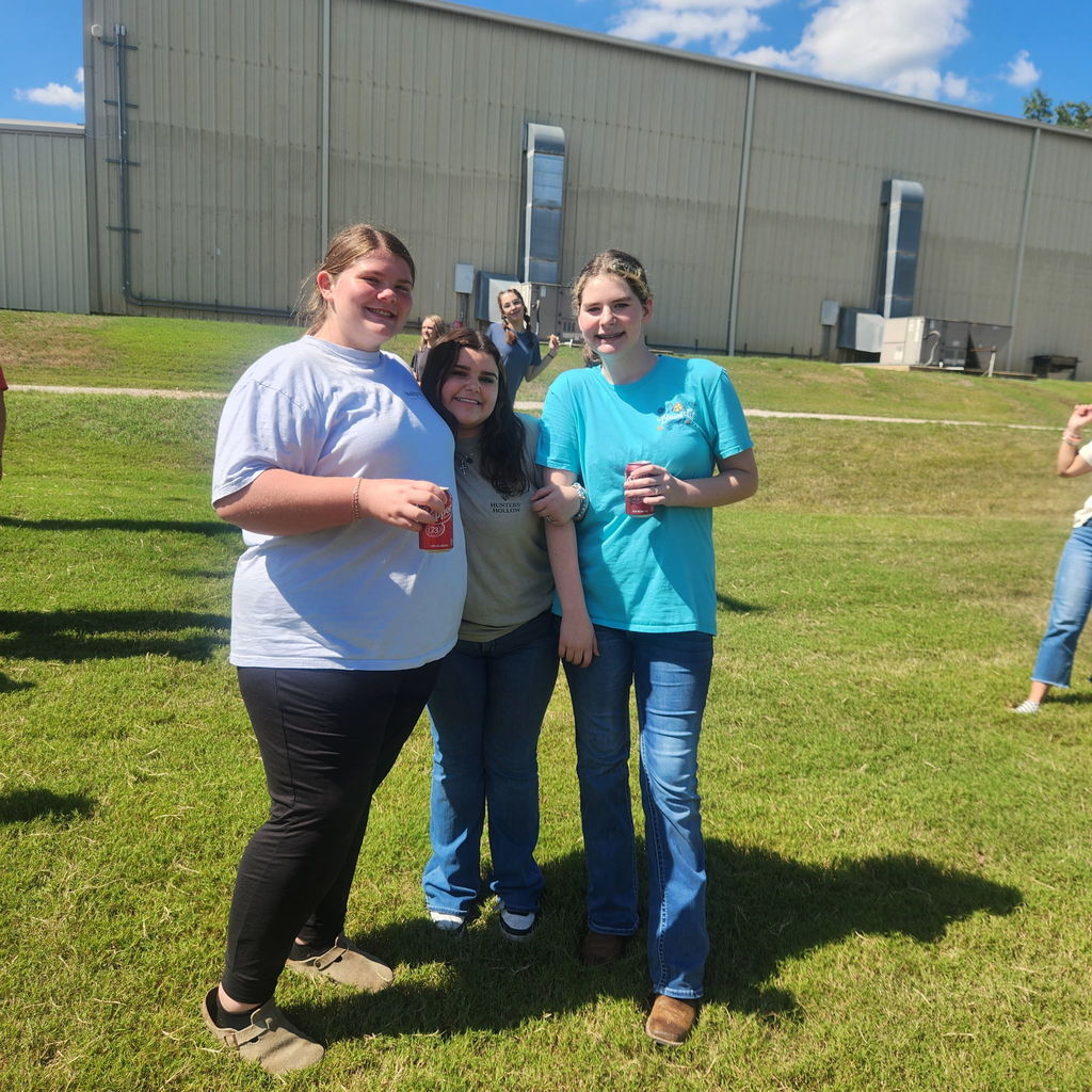 Junior high students mingling on the football field