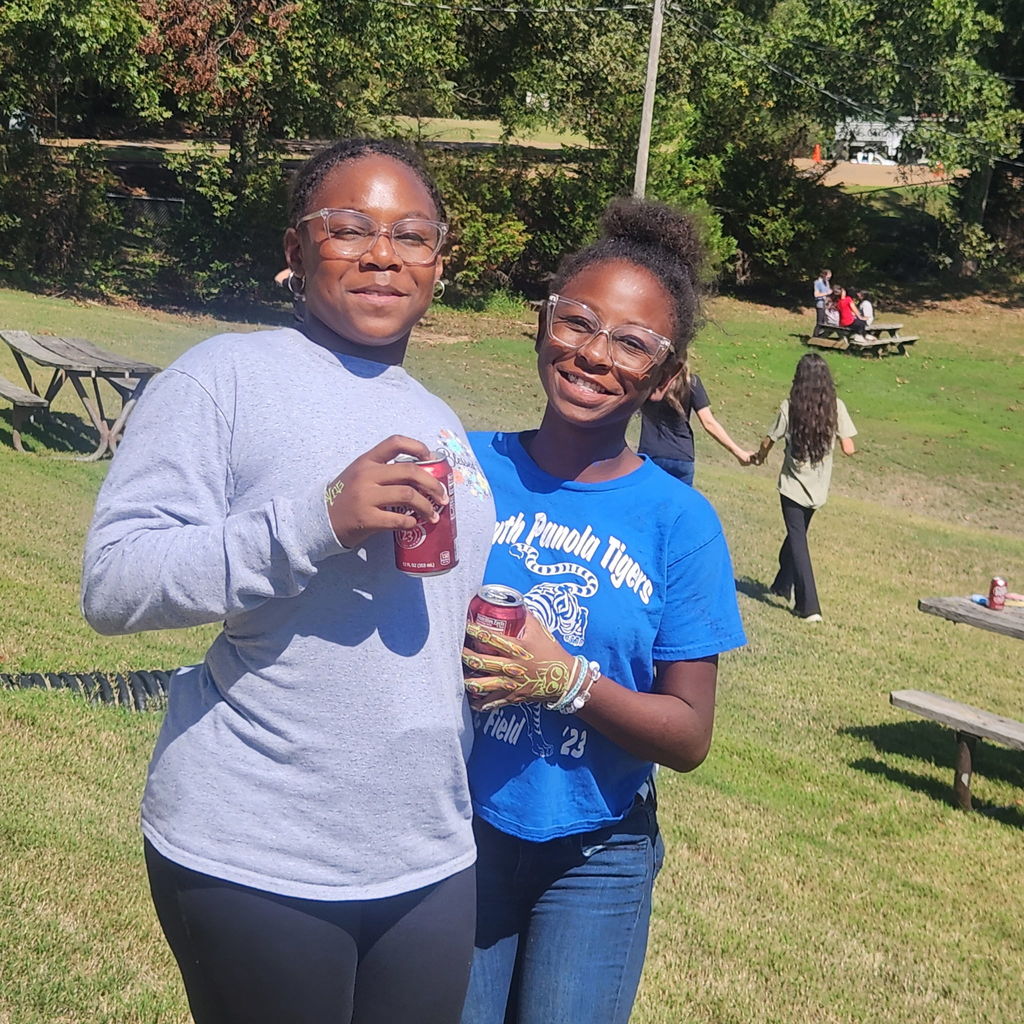 Junior high students mingling on the football field