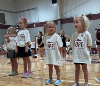 Elementary girls in Pope TShirts in the gym for Mini Cheer Camp