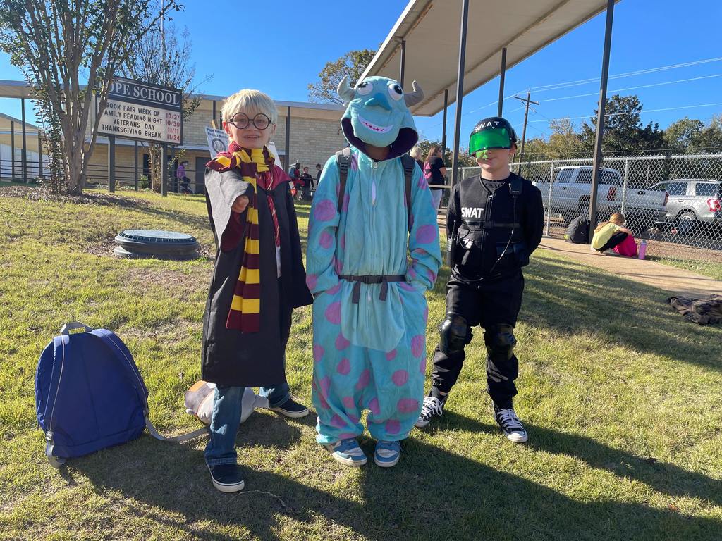 children dressed in Halloween costumes