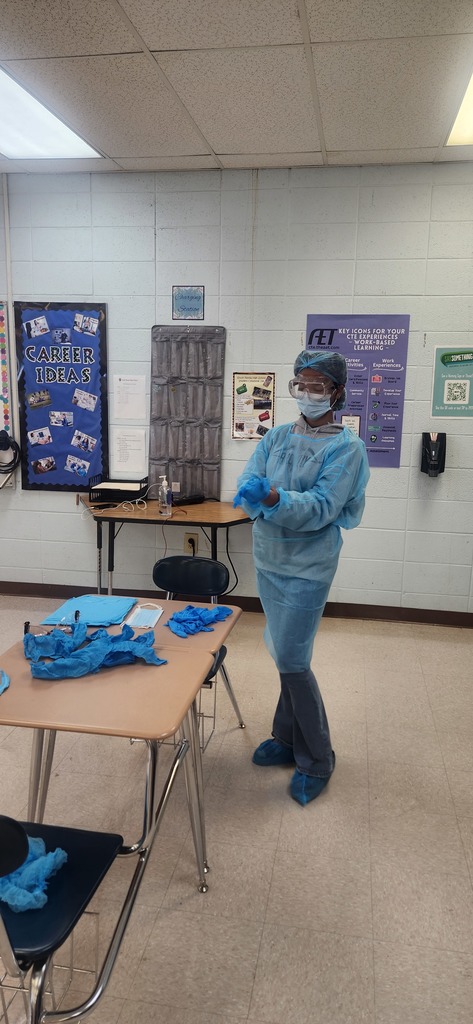 Health Science students learn how to properly don (put on) and doff (remove) personal protective equipment