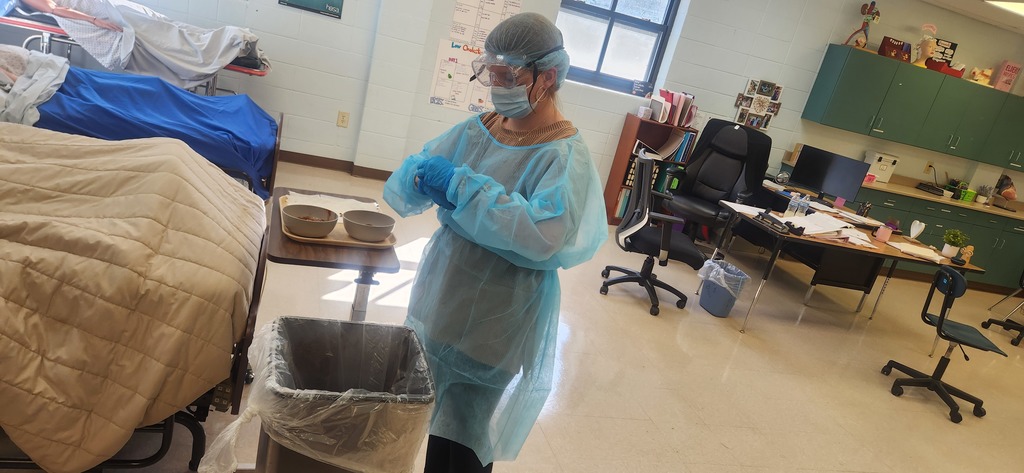 Health Science students learn how to properly don (put on) and doff (remove) personal protective equipment