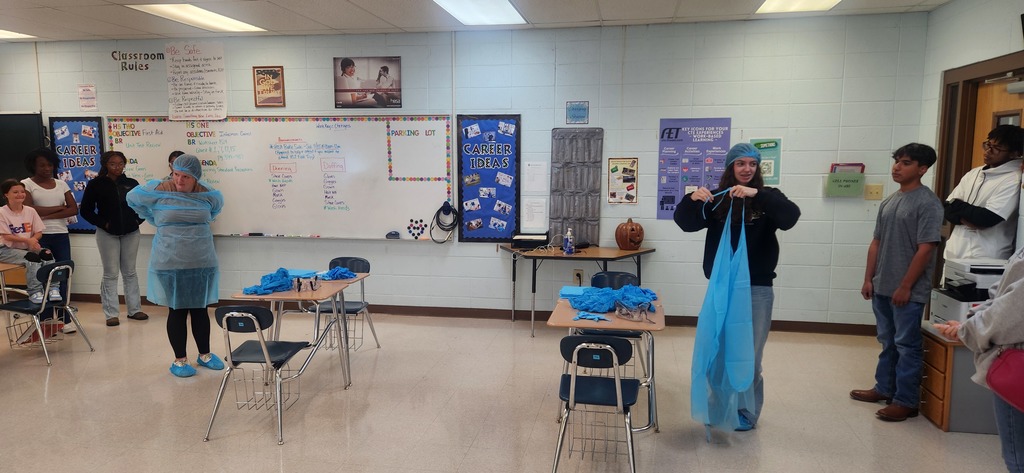 Health Science students learn how to properly don (put on) and doff (remove) personal protective equipment