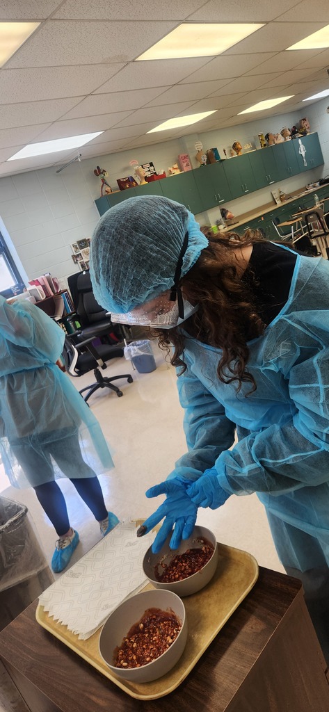 Health Science students learn how to properly don (put on) and doff (remove) personal protective equipment
