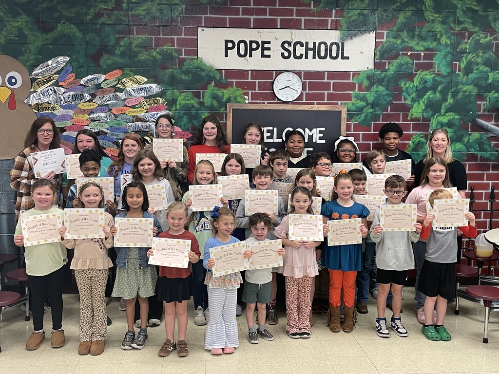 group of students and teachers standing with certificates