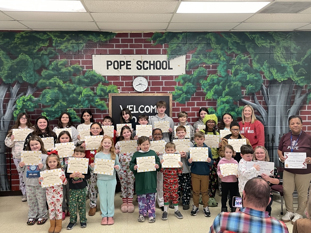 teacher, students, and administrator holding certificates