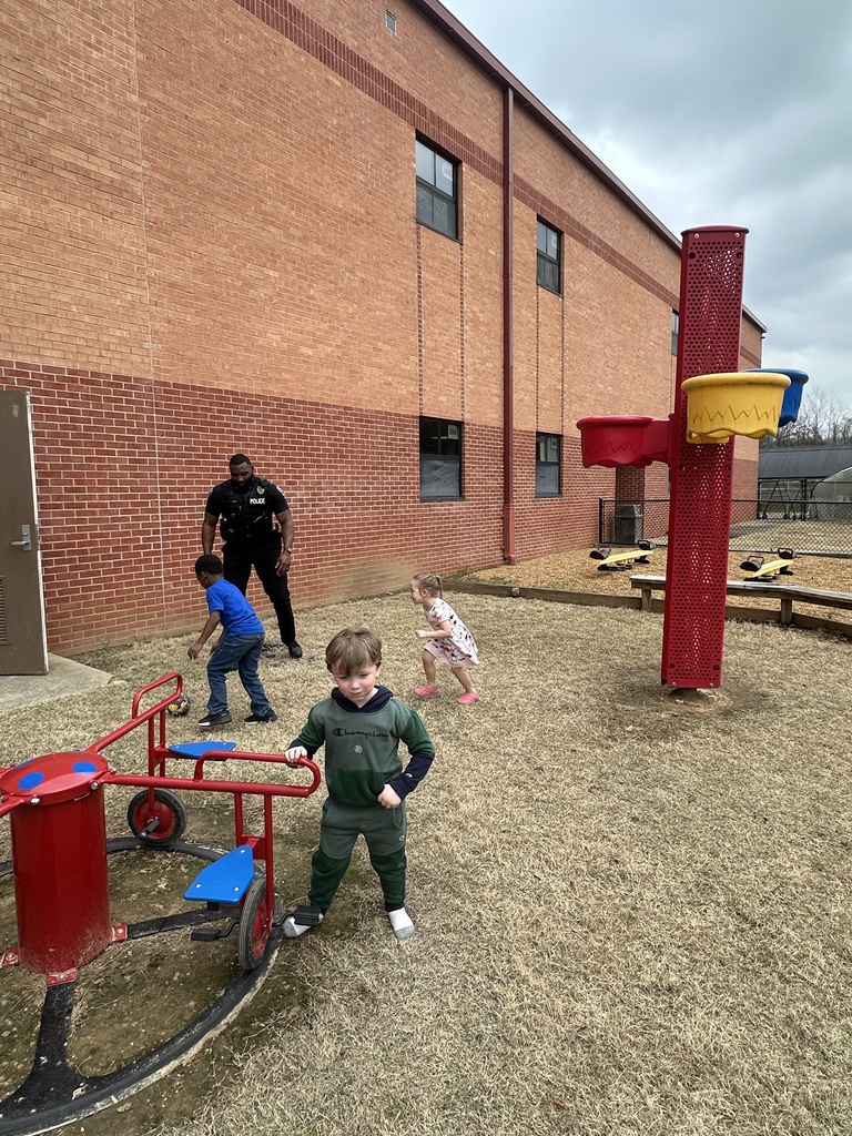 Sergeant Jarvis Smith takes time out of his day to come outside and play with our Tiger Care kids on the playground.