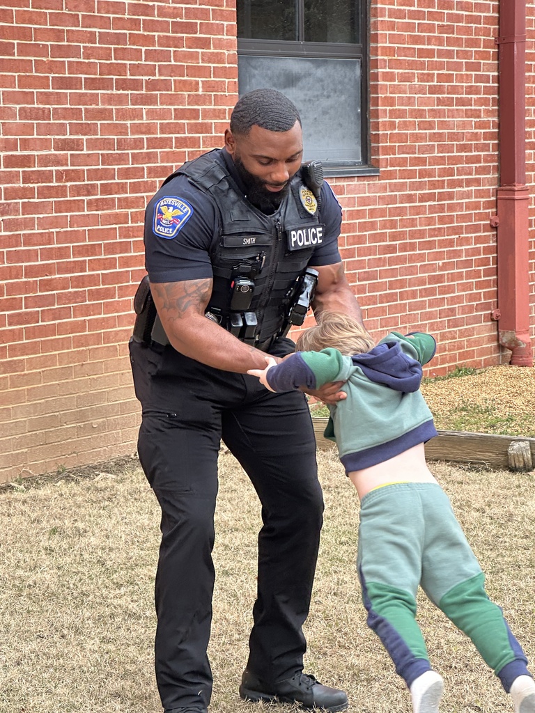 Sergeant Jarvis Smith takes time out of his day to come outside and play with our Tiger Care kids on the playground.