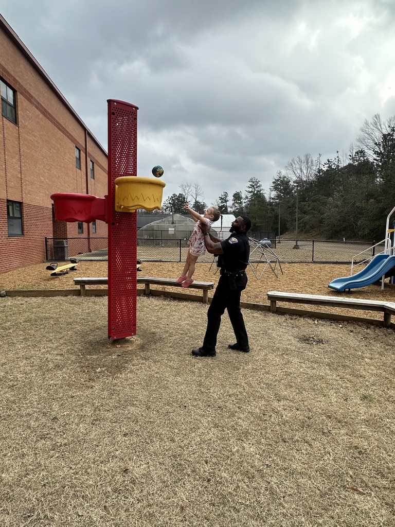 Sergeant Jarvis Smith takes time out of his day to come outside and play with our Tiger Care kids on the playground.