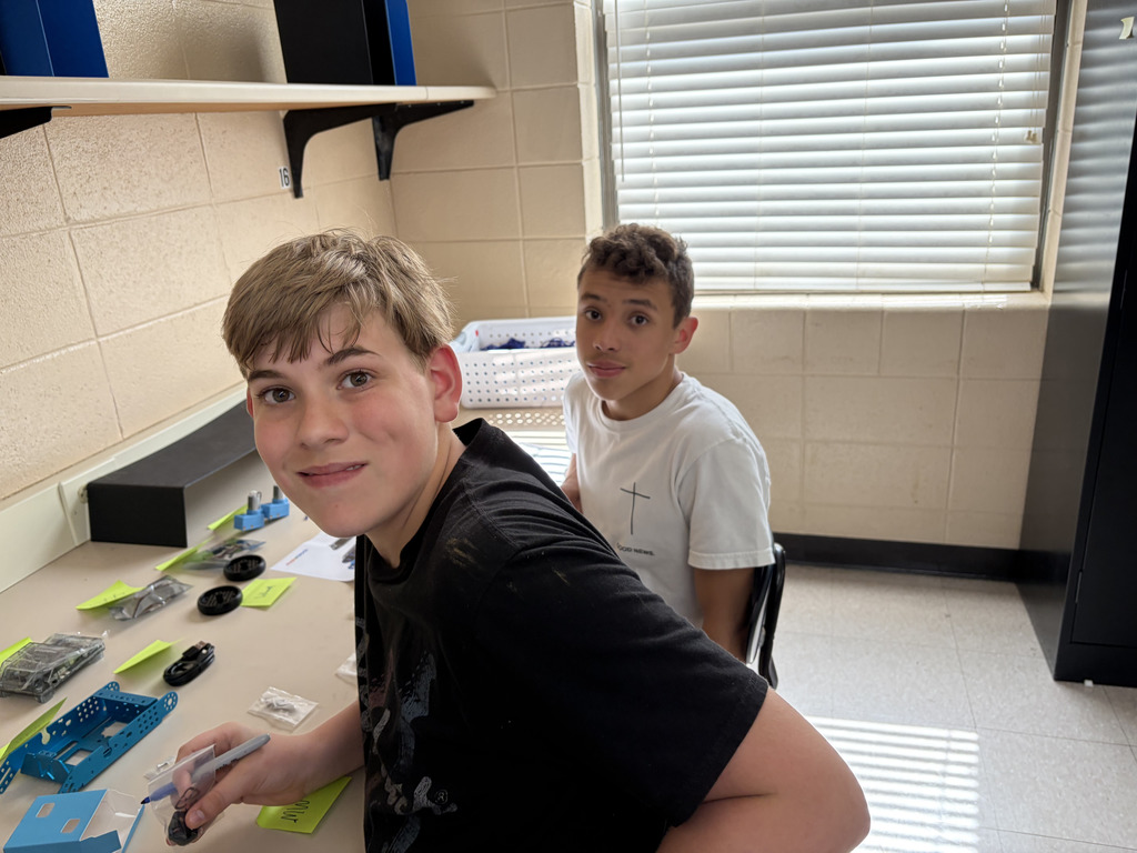 junior high students building robots