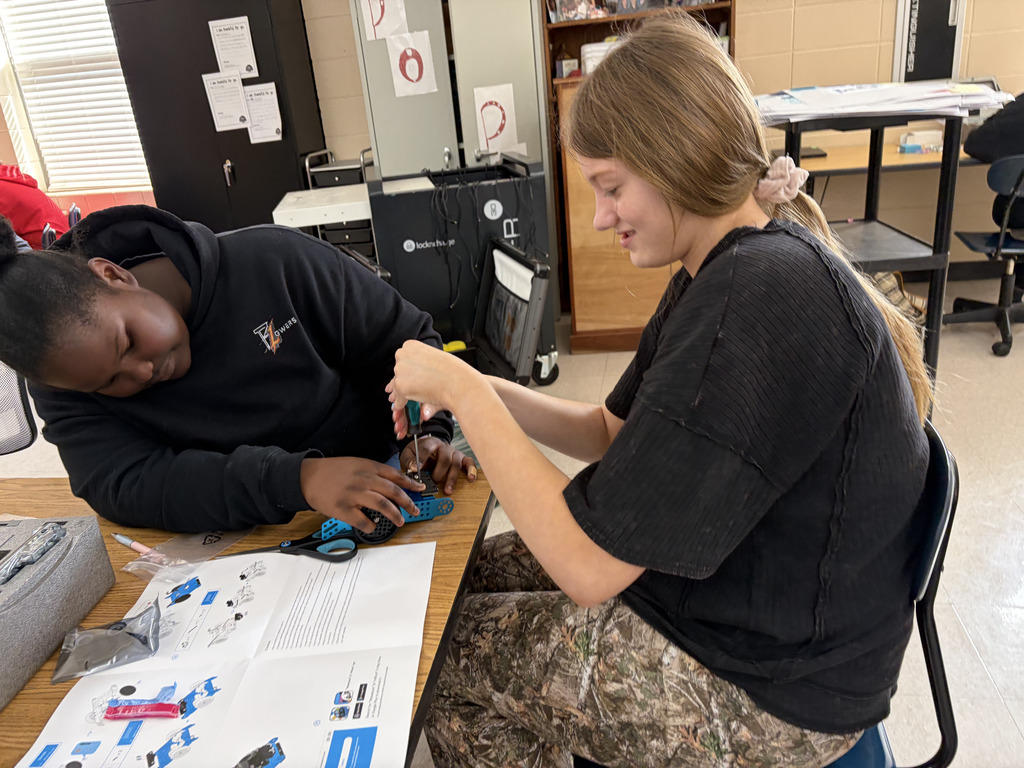 junior high students building robots
